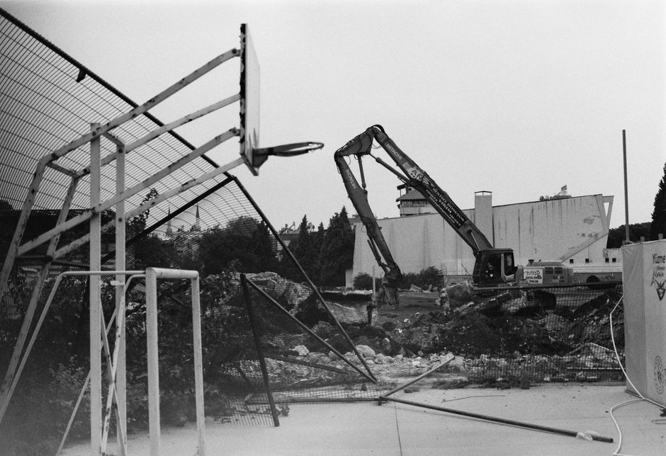Heavy machinery and rubble at a demolition site.