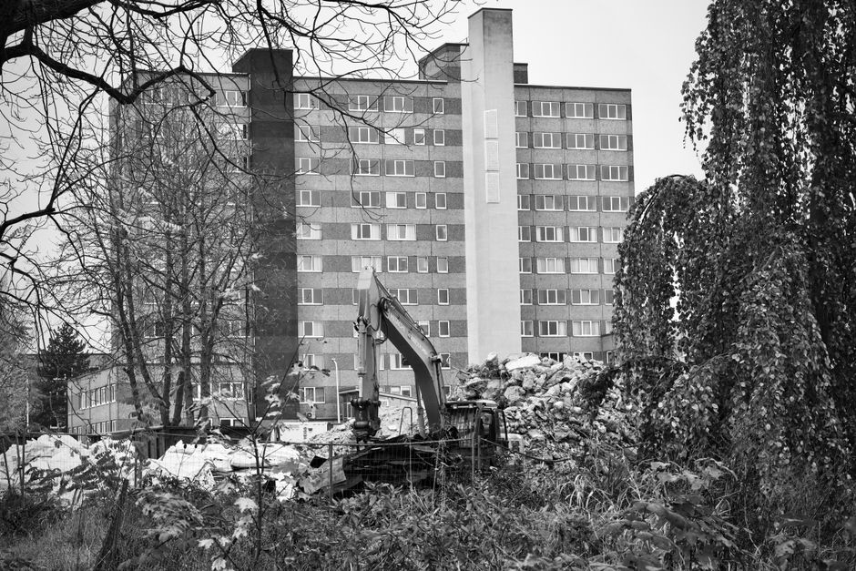 Heavy machinery and rubble at a demolition site.